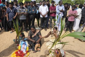 Tamils perform rituals in memory of their deceased family members on the strip of land in Mullivaikkal where civilians were trapped in 2009 during the final weeks of the civil war in Sri Lanka, May 17, 2024. © 2024 Eranga Jayawardena/AP Photo