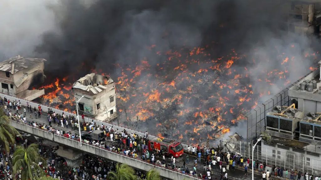 Smoke pours into the sky from a blaze at Bangabazar, one of the largest markets in Bangladesh.