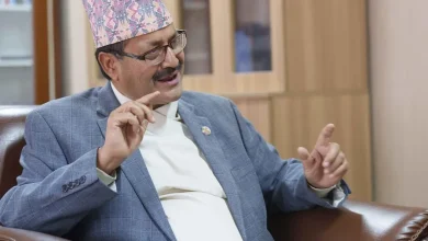 Nepal's new government, led by a communist prime minister, will be giving priority to enhancing relationship with both its giant neighbors India and China, but won't use them against each other for its own benefit, the newly appointed foreign minister said Wednesday.