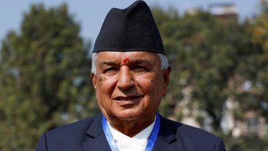 Nepali Congress party's presidential candidate, Ram Chandra Paudel poses for a picture upon his arrival to cast his vote to elect the President at the Parliament in Kathmandu