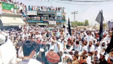 A large number of people assemble at Kargil Chowk in Lakki Marwat to protest incidents of terrorism and demand peace. — Dawn photo