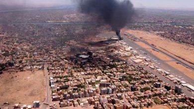 This image grab taken from AFPTV video footage on April 28, 2023, shows an aerial view of black smoke rising over Khartoum.