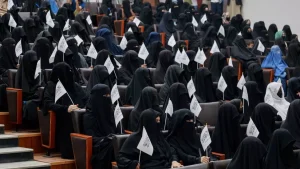 Veiled students attend a Taliban rally at the Shaheed Rabbani Education University in Kabul on Saturday.