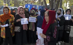 Veiled students attend a Taliban rally at the Shaheed Rabbani Education University in Kabul on Saturday.