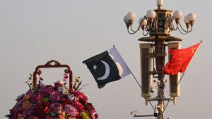 FILE PHOTO: Pakistani and Chinese national flags flutter next to an installation featuring a giant flower basket at the Tiananmen Square in Beijing, China October 7, 2019. REUTERS/Stringer