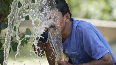 FILE - A person sprays water on his face from an irrigation pipe to beat the intense heat wave in Lucknow in the the Indian state of Uttar Pradesh, April 19, 2023. A searing heat wave in parts of southern Asia in April this year was made at least 30 times more likely by climate change, according to a rapid study by international scientists released Wednesday, May 17. (AP Photo/Rajesh Kumar Singh, File)