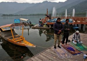 Muslim men offer prayers on the banks of Dal Lake, during the fasting month of Ramadan, in Srinagar, April 19, 2022. REUTERS/Danish Ismail/File Photo