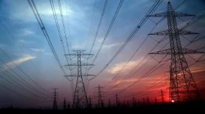 Sunrise over the ultra-high voltage lines of the west-to-east electricity transmission project.