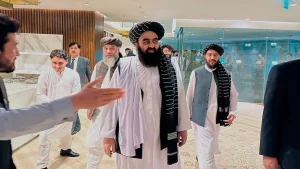 in this photo provided by Afghanistan Embassy in Pakistan, the Taliban-appointed Foreign Minister Amir Khan Muttaqi, center, walks with other officials upon his arrival in airport, in Islamabad, Pakistan, Friday, May 5, 2023. Muttaqi arrived in Islamabad on Friday to attend a meeting.