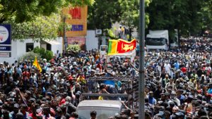 Demonstrators gather outside the office of Sri Lanka's Prime Minister Ranil Wickremesinghe, amid the country's economic crisis, in Colombo, Sri Lanka July 13, 2022. REUTERS/Adnan Abidi