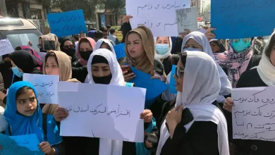 Afghan women chant and hold signs during a demonstration in Kabul [File: Mohammed Shoaib Amin/AP]