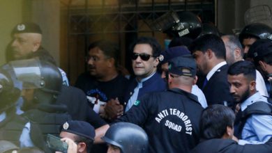 Security officers escort Pakistan's former Prime Minister Imran Khan, as he appeared in Islamabad High Court, Islamabad, Pakistan May 12, 2023. REUTERS/Akhtar Soomro