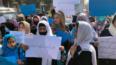 Afghan women chant and hold signs of protest during a demonstration in Kabul, Afghanistan, in March 2022 [File: Mohammed Shoaib Amin/AP Photo]