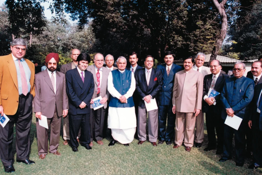 Kanwal Rekhi, center wearing a red tie, with Prime Minister Atal Bihari Vajpayee, on his left, in April 2000.Credit...via Kanwal Rekhi
