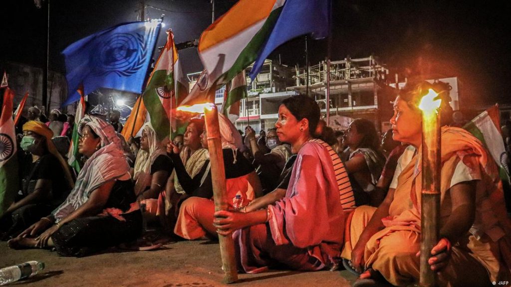 Thousands of people, mostly women, held a massive sit-in in India's violence-wracked northeastern state of Manipur to demand the immediate arrest of anyone involved in the assaults