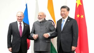 Russia's President Vladimir Putin (L), India's Prime Minister Narendra Modi (C) and China?s President Xi Jinping pose for a picture during a meeting on the sidelines of the G20 summit in Osaka, Japan June 28, 2019. Sputnik/Mikhail