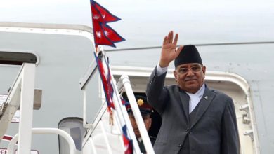 Prime Minister Pushpa Kamal Dahal waves as he boards an aircraft. Photo courtesy: PMO secretariat