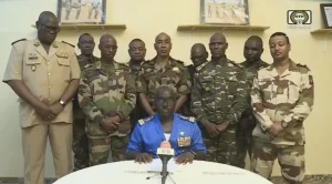 Col. Maj. Amadou Abdramane, front center, with a delegation of military officers, appear on Niger State TV to announce their coup on July 26, 2023, in Niamey, Niger. © 2023 ORTN/Tele Sahel/Anadolu Agency via Getty Images