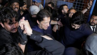 File Photo: Pakistan's former Prime Minister, Imran Khan, along with his supporters walks as he leaves the district High Court in Lahore, Pakistan February 20, 2023. REUTERS/Mohsin Raza