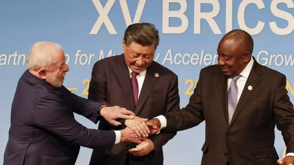 Brazilian President Luiz Inacio Lula da Silva, Chinese President Xi Jinping and South African President Cyril Ramaphosa are seen at the Brics summit in Johannesburg, on 23 August 2023 (AFP)