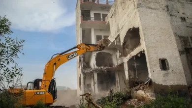 A bulldozer demolishes the property of a Muslim in Haryana's Nuh district [Md Meharban/Al Jazeera]
