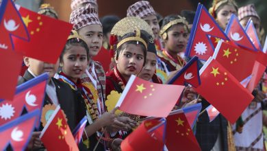 Nepalese children wave national flags of China and Nepal to welcome Chinese President Xi Jinping for a state visit in Nepal in October 2019. Photo: cnsphoto