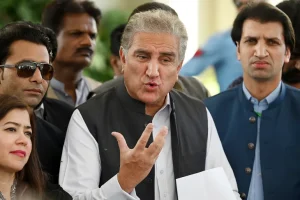 Shah Mahmood Qureshi (centre), former foreign minister and leader of Pakistan Tehreek-e-Insaf (PTI) party, was arrested for his alleged role in 'exposing official secrets and harming state interests' [File: Aamir Qureshi/AFP]