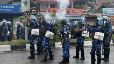 FILE PHOTO-Riot police officers fire tear smoke shells to disperse demonstrators protesting against the arrest of five people, who police said were carrying weapons while wearing camouflage uniform, in Imphal, Manipur, India, September 18, 2023. REUTERS/Stringer/File Photo