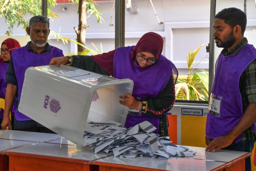 Electoral workers examine ballots while vote counting during Maldives‘ presidential election in Male on September 9, 2023. | Photo Credit: AFP