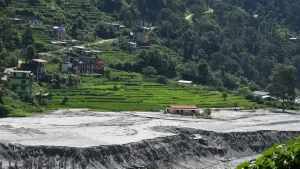 Water and debris tumbled 40 km along Nepal's Melamchi River following heavy rains in 2021, claiming lives and damaging homes and infrastructure. Photo credit: Kamran Akbar/World Bank.