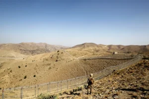A Pakistani soldier stands guard on the border with Afghanistan in North Waziristan, Pakistan [Caren Firouz/Reuters]