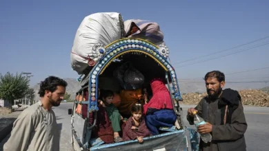 Afghan nationals along with their families stand along a road near a vehicle in the Jamrud area of Khyber district, Peshawar as they return to Afghanistan following Pakistan`s government`s decision to expel people illegally staying in the country on October 6, 2023 Photo: AFP