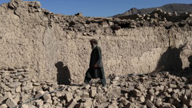 An Afghan man walks past a damaged house after the recent earthquake in Wor Kali village in the Barmal district of Paktika province, Afghanistan, June 25, 2022. REUTERS/Ali Khara/File Photo