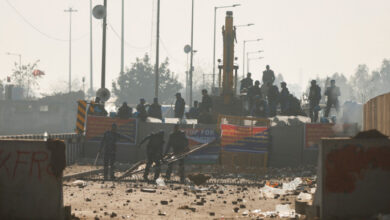 Police move a makeshift barricade at the site of a protest as farmers march towards New Delhi to push for better crop prices promised to them in 2021, at Shambhu Barrier, the border between Punjab and Haryana states, India February 23, 2024. REUTERS/Francis Mascarenhas