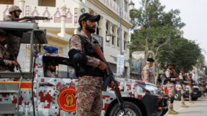 Paramilitary soldiers stand guard along a road, ahead of the general elections in Karachi, Pakistan 7 February, 2024. Photo: REUTERS/Akhtar Soomro