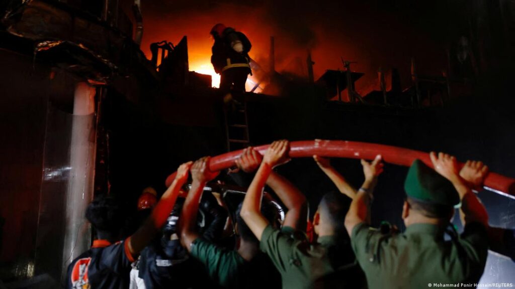 Fire Service members rescue woman from atop the building that caught fire in Baily Road, Dhaka, on 29 February 2024.