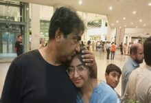 A MAN greets a student who returned from Kyrgyzstan at the Islamabad International Airport, on Sunday.—Dawn
