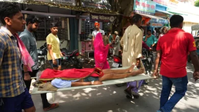 An elderly person suffering from heat related ailment is carried on a stretcher to a government hospital in Ballia, Uttar Pradesh state [Rajesh Kumar Singh/AP]