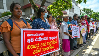 Protesters near the Russian embassy in Colombo seeking the release of Sri Lankan ex-soldiers who joined forces fighting in Ukraine after Russia's invasion. (File photo: AFP/Ishara S Kodikara)