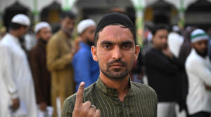 A Muslim man shows his inked finger after casting his ballot to vote in the first phase of India's general election at a polling station in Kairana, Shamli district, in India's Uttar Pradesh state on April 19, 2024. (Photo by Sajjad HUSSAIN / AFP)(AFP)