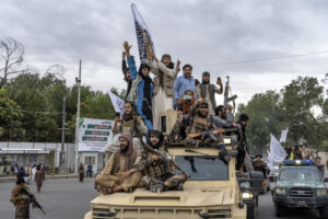 Taliban fighters celebrate one year since they seized the Afghan capital, Kabul, in front of the U.S. Embassy in Kabul, Afghanistan, Monday, Aug. 15, 2022. The Taliban on Tuesday, July 30, 2024, 