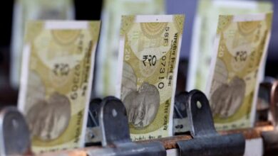 Indian rupee dips to lifetime low on dollar bids by foreign banks