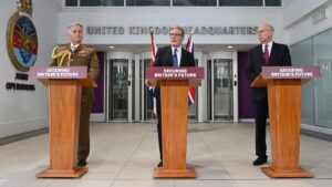 General James Hockenhull (L), Britain’s Prime Minister Keir Starmer and Britain’s Defence Secretary John Healey (R), attend a press conference following a deal on the Chagos Islands at Northwood Military Headquarters on May 22, 2025, in London, England. | Photo Credit: Getty Images