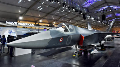 Visitors stand next to a prototype of the Advanced Medium Combat Aircraft (AMCA), India's most advanced stealth fighter jet, at the "Aero India 2025" air show at Yelahanka air base in Bengaluru, India, February 11, 2025. REUTERS/Stringer/File Photo