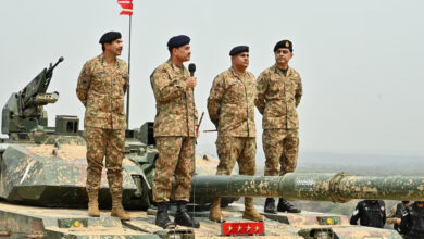 Chief of Army Staff of Pakistan Asim Munir holds a microphone during his visit at the Tilla Field Firing Ranges (TFFR) to witness the Exercise Hammer Strike, a high-intensity field training exercise conducted by the Pakistan Army's Mangla Strike Corps, in Mangla, Pakistan May 1, 2025. Photo: Inter-Services Public Relations (ISPR)/Handout via REUTERS/File Photo