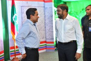 JP's leader Qasim Ibrahim (R) with then-President Abdulla Yameen Abdul Gayoom. (File Photo/Maldives Independent)