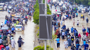 People wade through a flooded Sharea Faisal after the monsoon rain in Karachi on August 19, 2025. Photo: Reuters