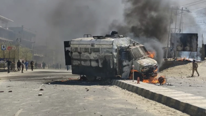 A police vehicle is set on fire during a protest by locals demanding federal statehood from the Indian government, in the high-altitude Leh town, in the region of Ladakh, India, Wednesday, Sept. 24, 2025. (AP Photo)