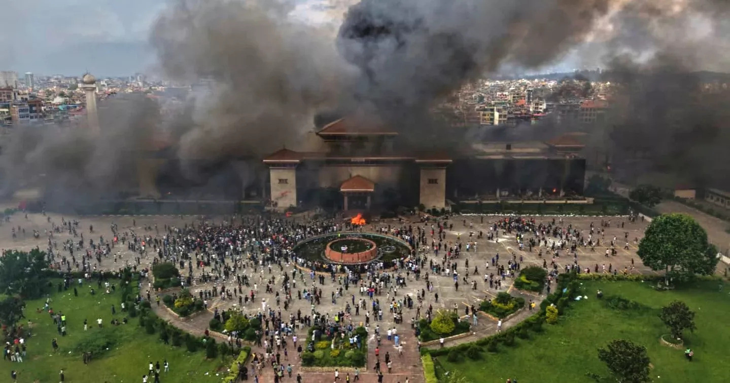 Armed soldiers guard Kathmandu streets Wednesday, urging residents to stay home following widespread violence in which protesters stormed government buildings and targeted politicians. Photo: AP