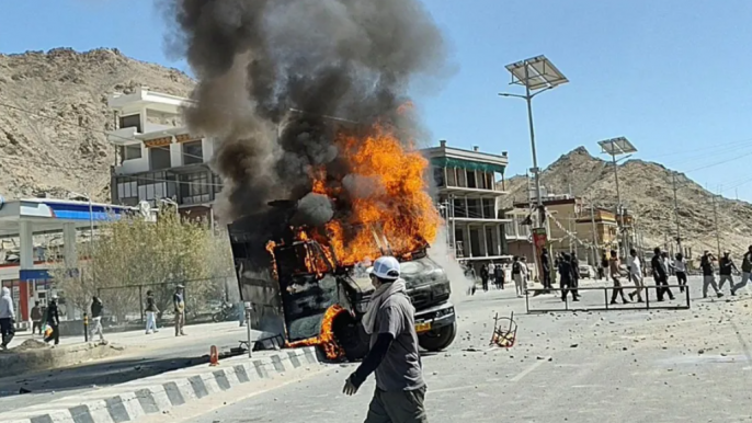 Protesters set fire to a local office of the ruling BJP and a security vehicle. Photo: Reuters